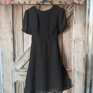 Black puffed cap sleeve dress